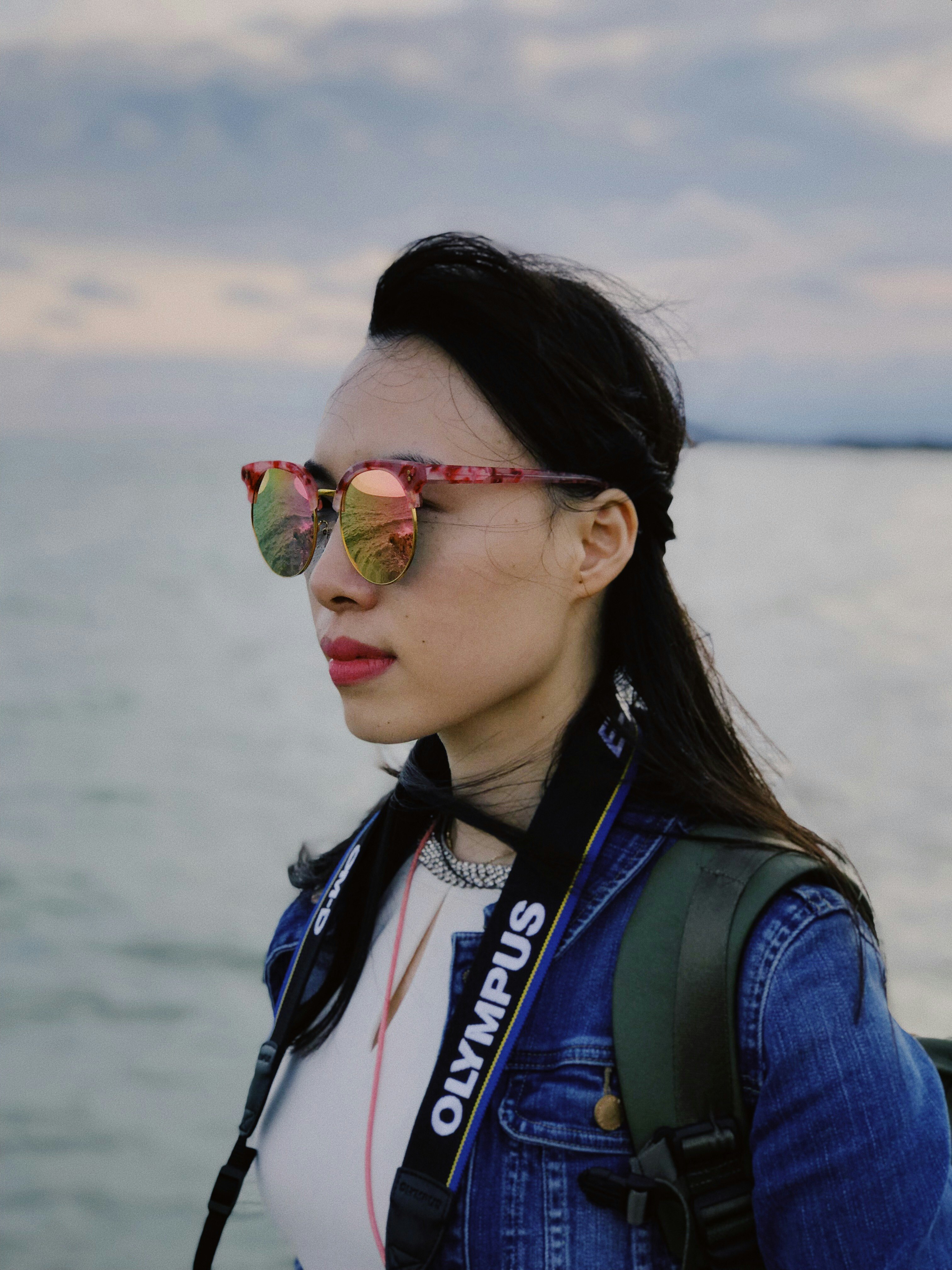 woman wearing blue denim jacket